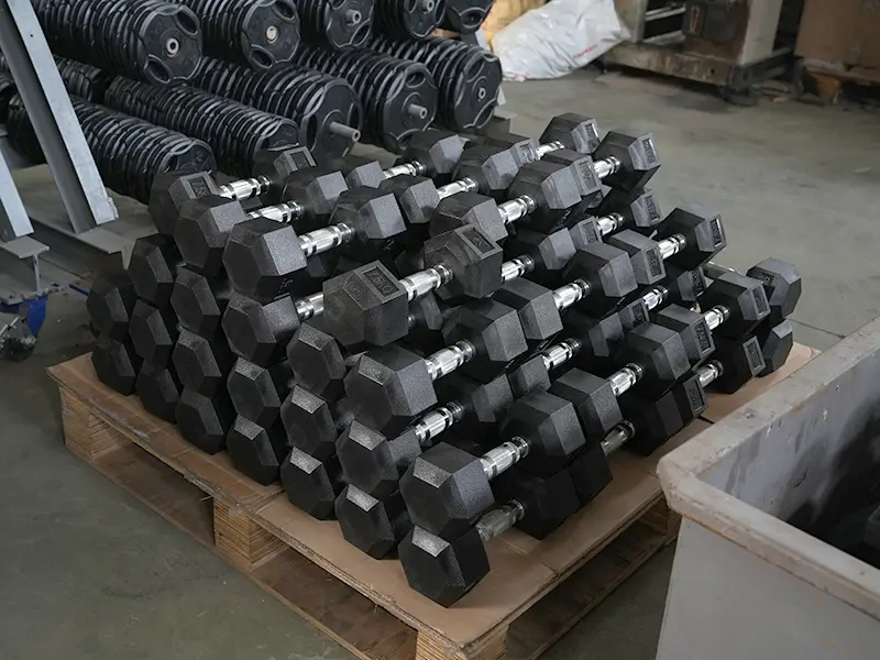 Dumbbell manufacturing and quality inspection at a fitness equipment factory in China