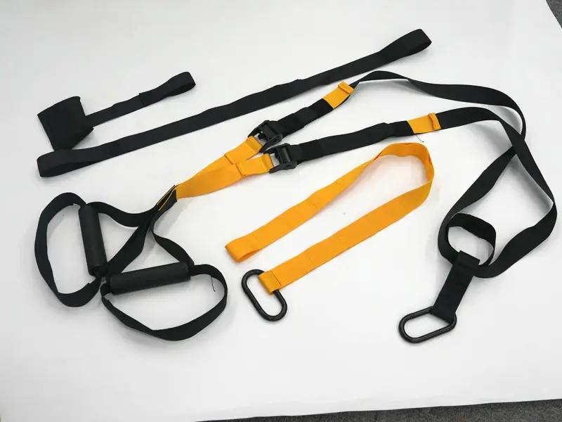 Suspension training kit with adjustable straps, handles and door anchor