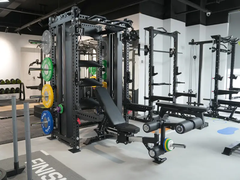 VIGFIT strength equipment display with power racks, Smith machines and weight benches