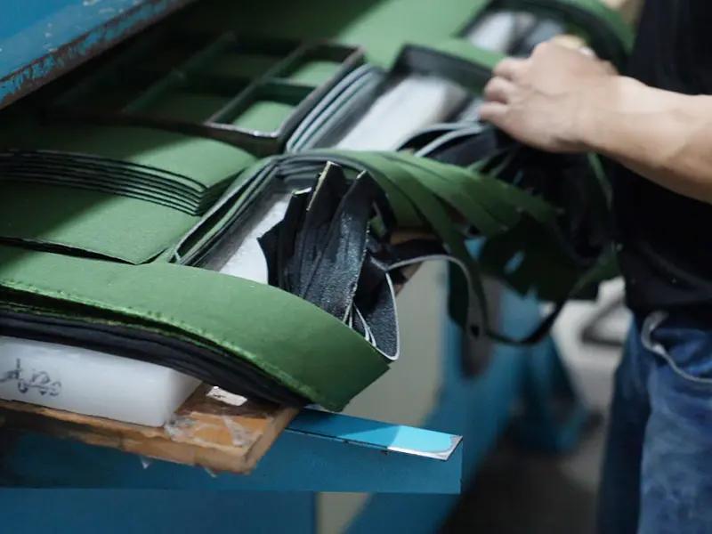 Cutting fabric panels for sewn training products