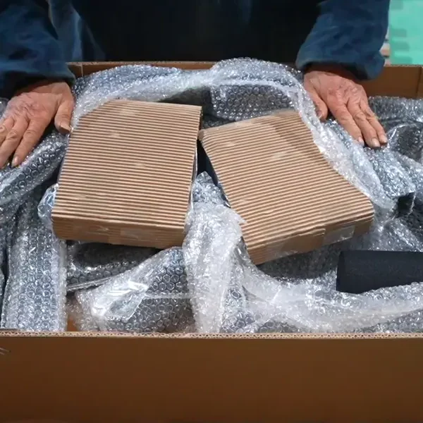 Packaged strength equipment being loaded into a shipping container