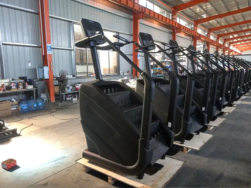 Stair climber with rotating steps, handrails and console